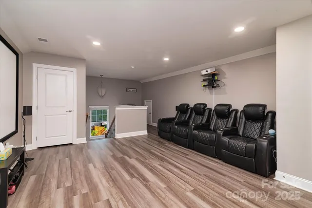 a bed room with furniture and a chandelier