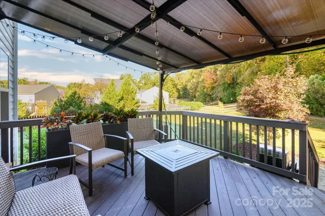 an aerial view of a house with a yard and potted plants