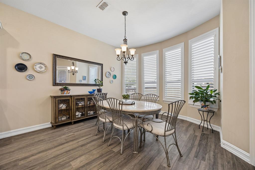 948 Holt Lane Allen, TX 75013 - Photo 11 of 40 Even more seating with kitchen nook area. Looks out to backyard through the plantation shutters