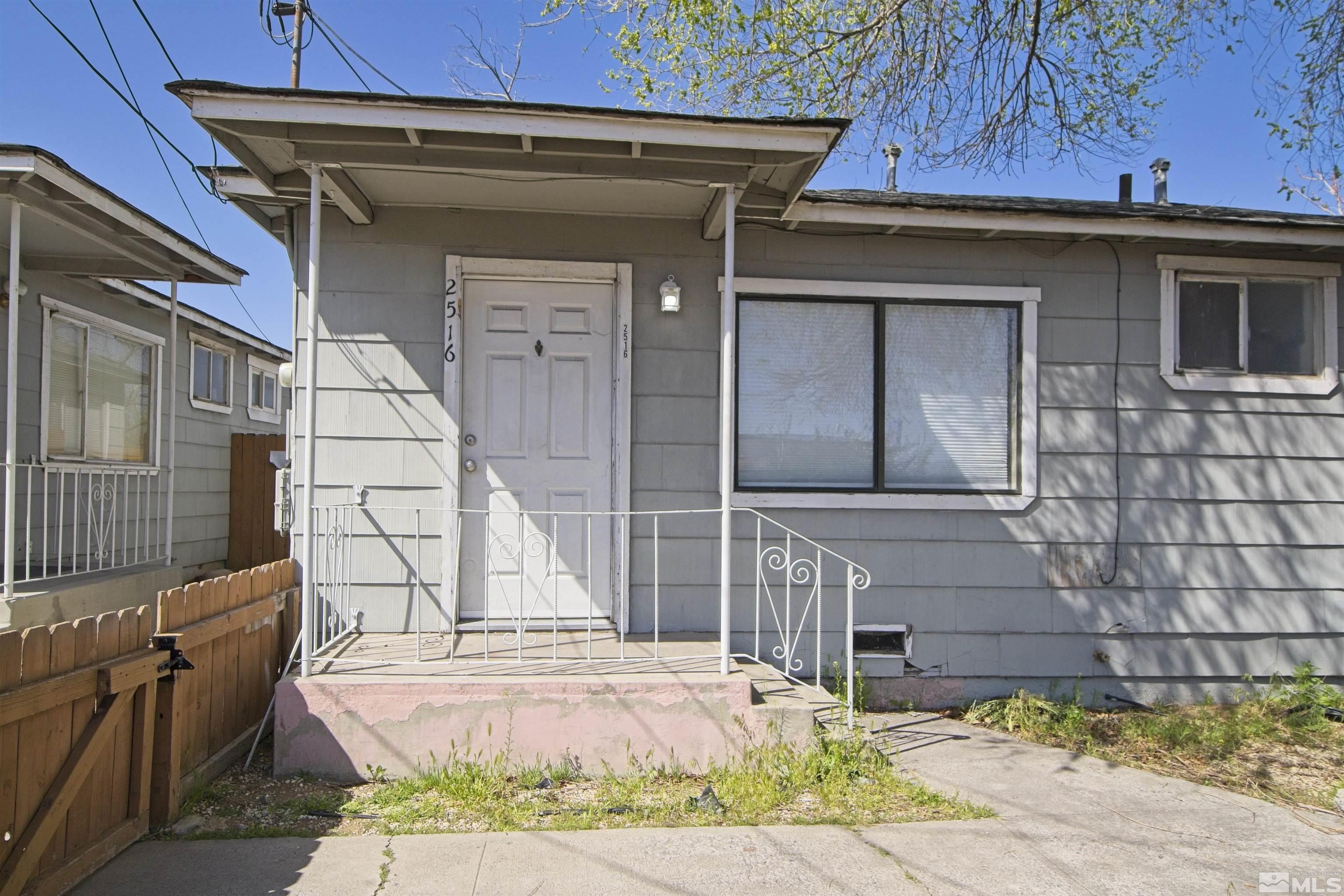 2516 D Street Sparks, NV 89431 - Photo 1 of 9 a front view of a house with a garden