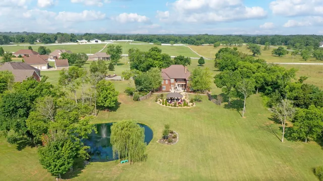 a view of a lake with houses in the back