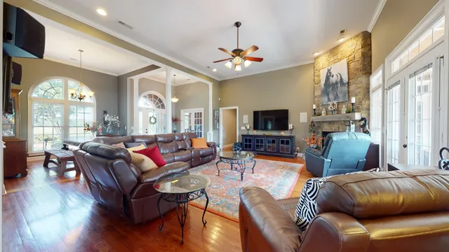 a living room with furniture and a fireplace