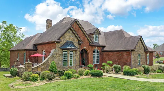 a front view of a house with a yard