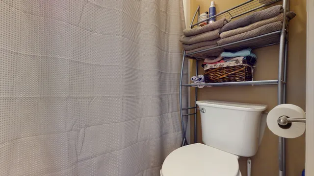 a bathroom with a double vanity sink mirror and shower