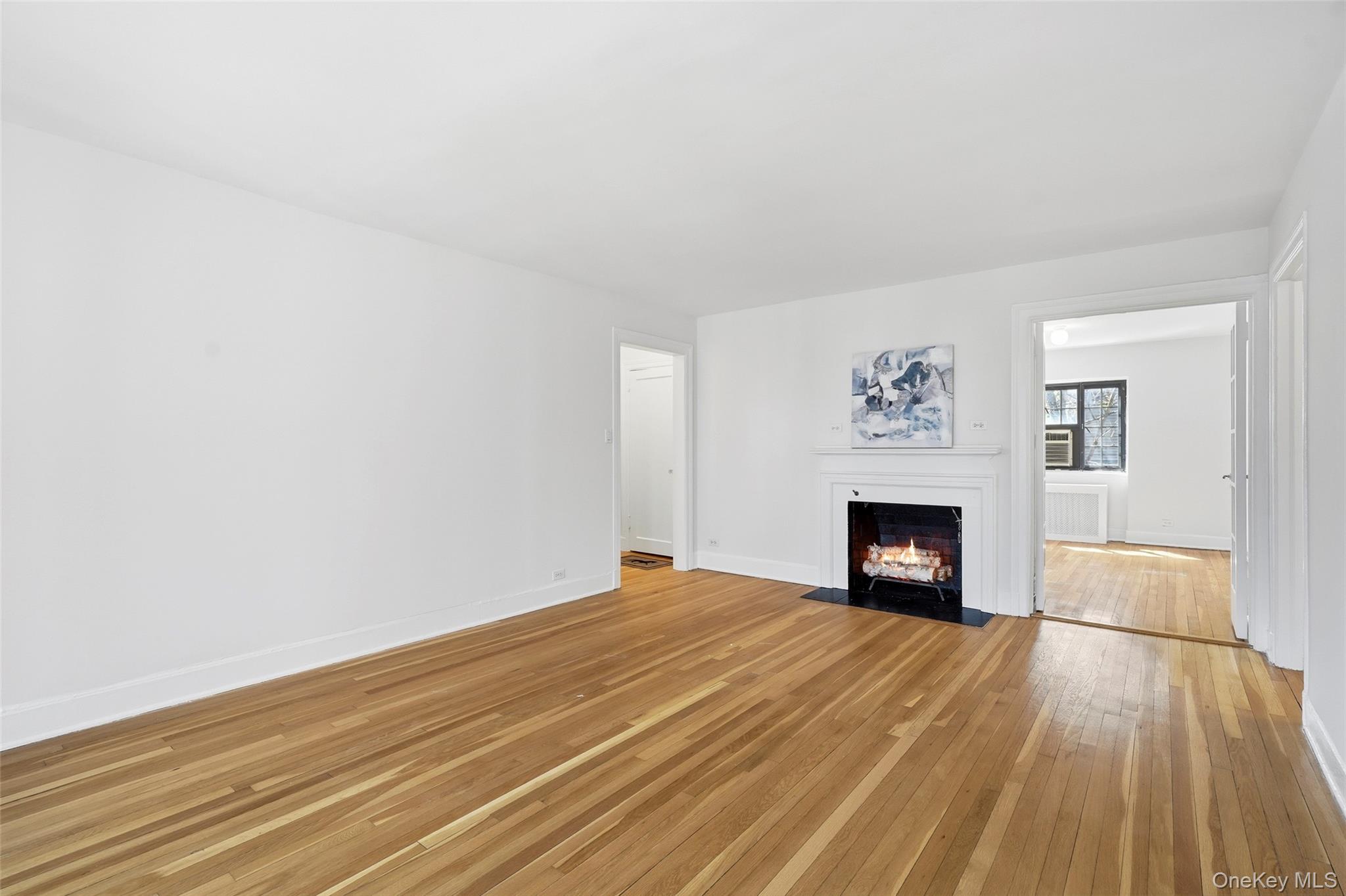 6 Davis Avenue, Unit C22 Rye, NY 10580 - Photo 3 of 20 Enter the Living Room from the Entry Foyer, flows into the Eat-in Kitchen