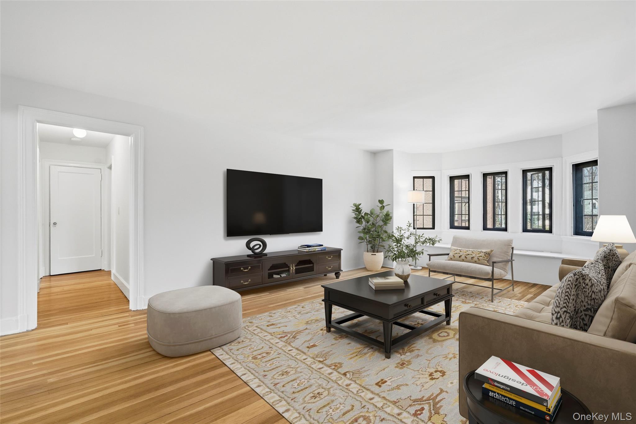 6 Davis Avenue, Unit C22 Rye, NY 10580 - Photo 8 of 20 Virtually staged -- Living Room with wall of windows looking out on the courtyard
