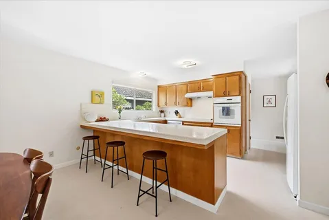 a kitchen with a table and chairs in it