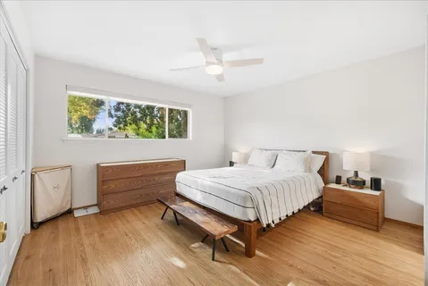 a bedroom with a bed and a dresser