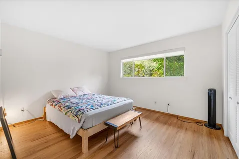 a room with a bed and a window