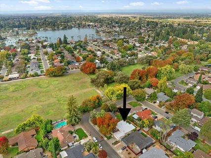 an aerial view of residential houses with outdoor space