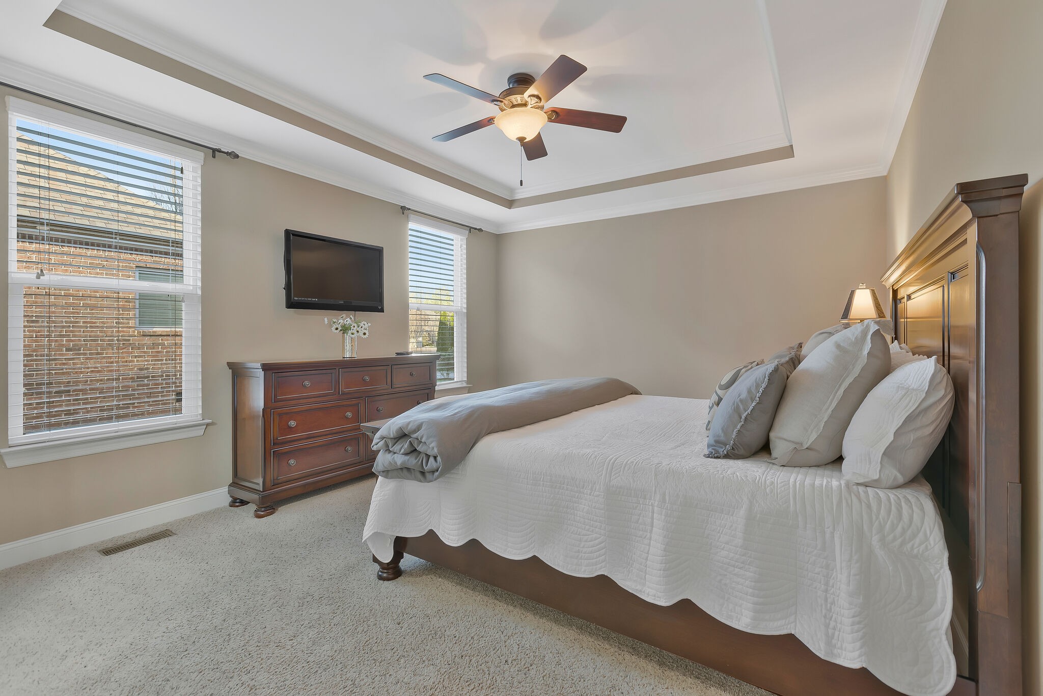119 Verde Meadow Drive Franklin, TN 37067 - Photo 16 of 35 a bedroom with a bed and a flat screen tv