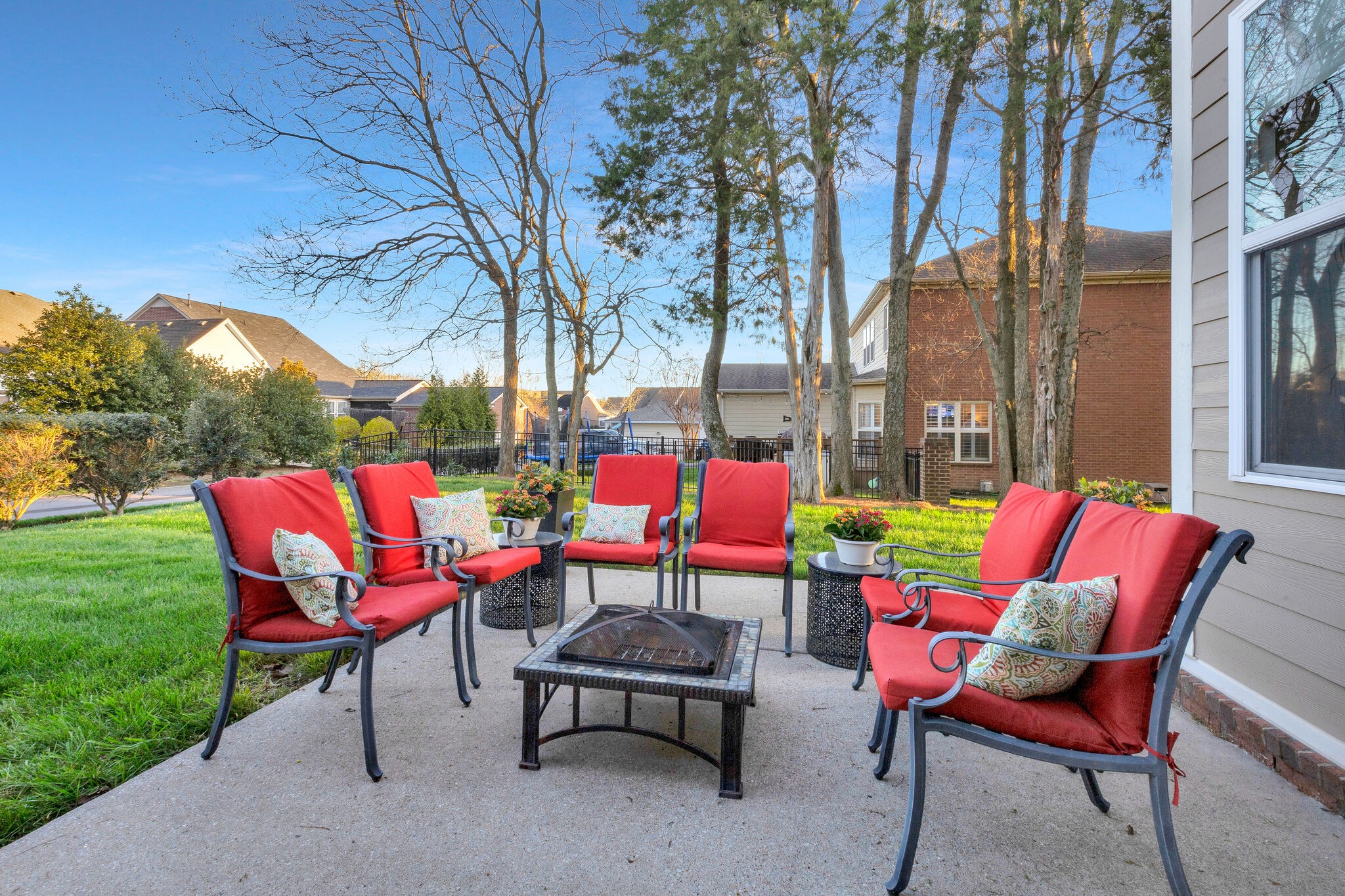 119 Verde Meadow Drive Franklin, TN 37067 - Photo 28 of 35 a view of a chairs and tables in the back yard of the house