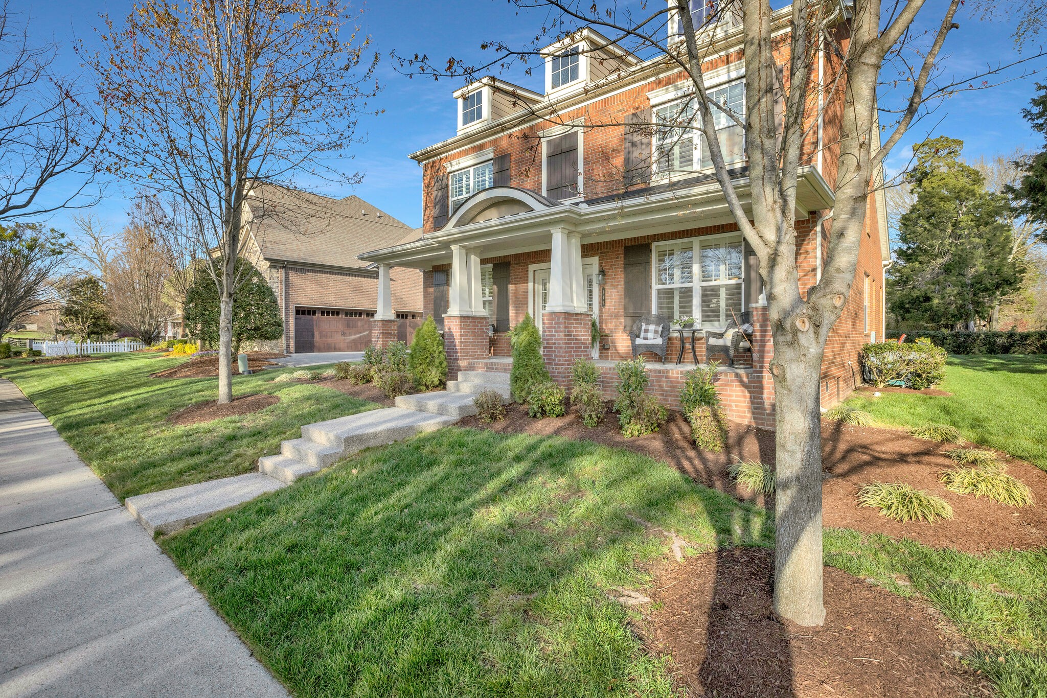 119 Verde Meadow Drive Franklin, TN 37067 - Photo 4 of 35 a view of a white house with a big yard and large tree