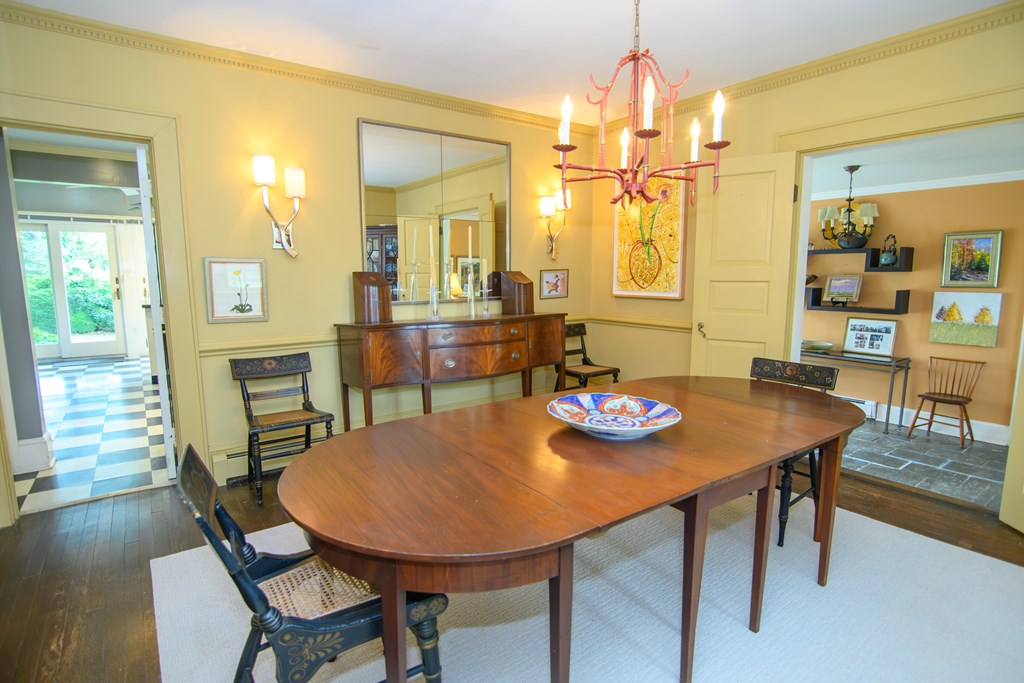 23347 Back Street Accomac, VA 23301 - Photo 18 of 44 Formal Dining Room, Features include crown molding, sconces, and hardwood floors.