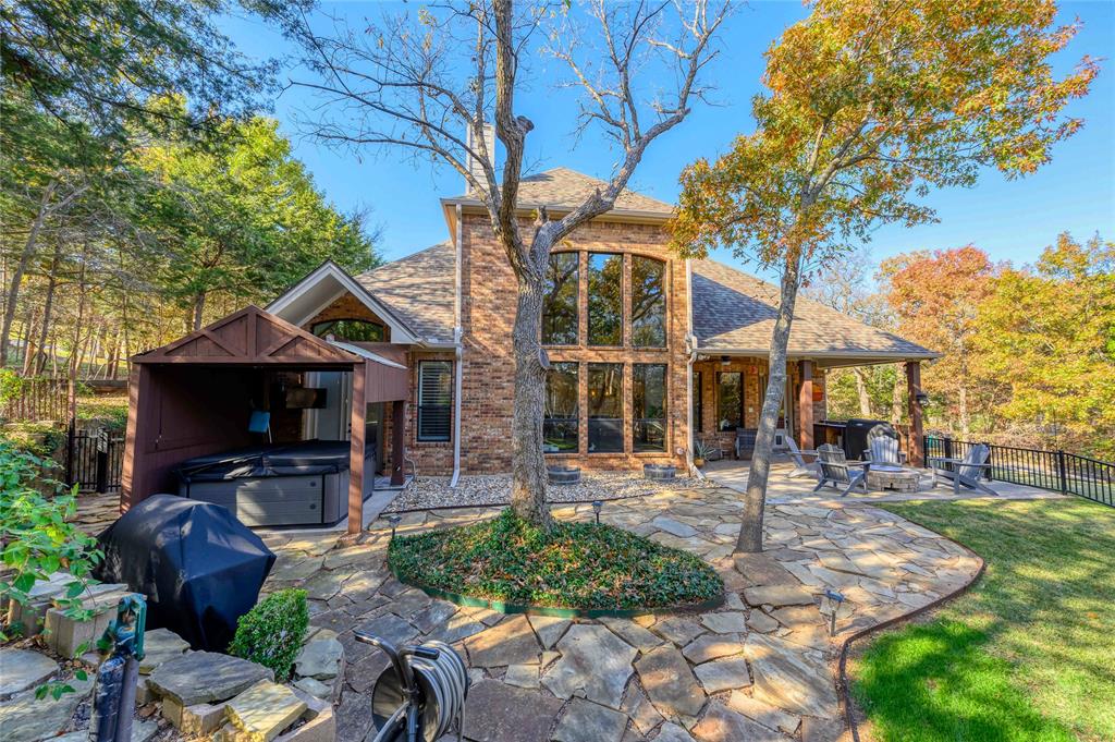 588 Lakepoint Loop Pottsboro, TX 75076 - Photo 38 of 39 a front view of a house with garden