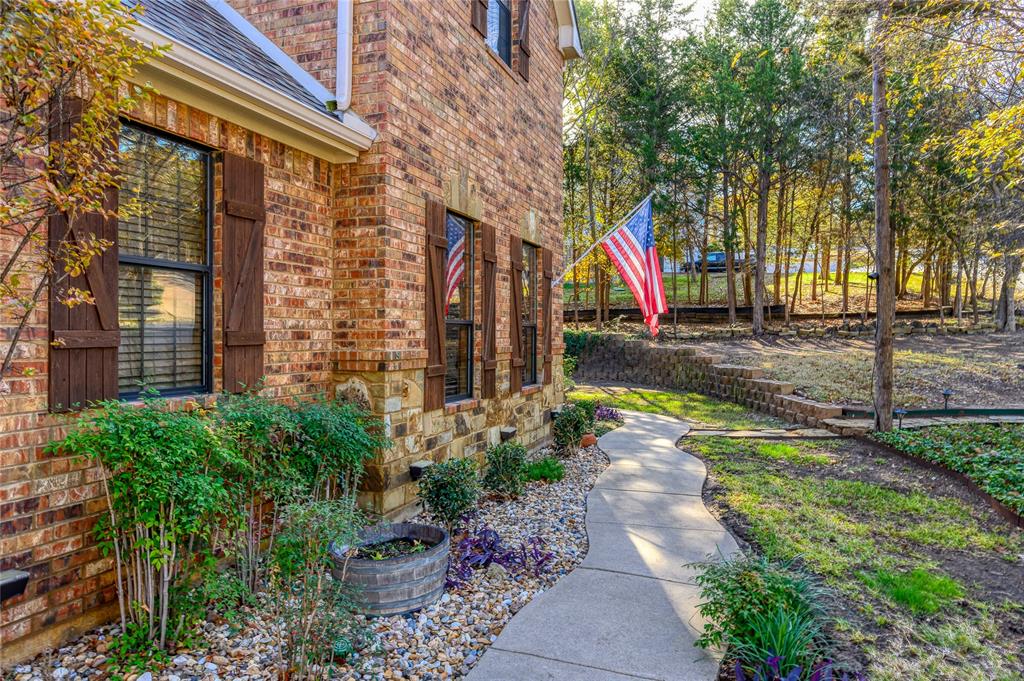 588 Lakepoint Loop Pottsboro, TX 75076 - Photo 4 of 39 a view of a pathway with a backyard