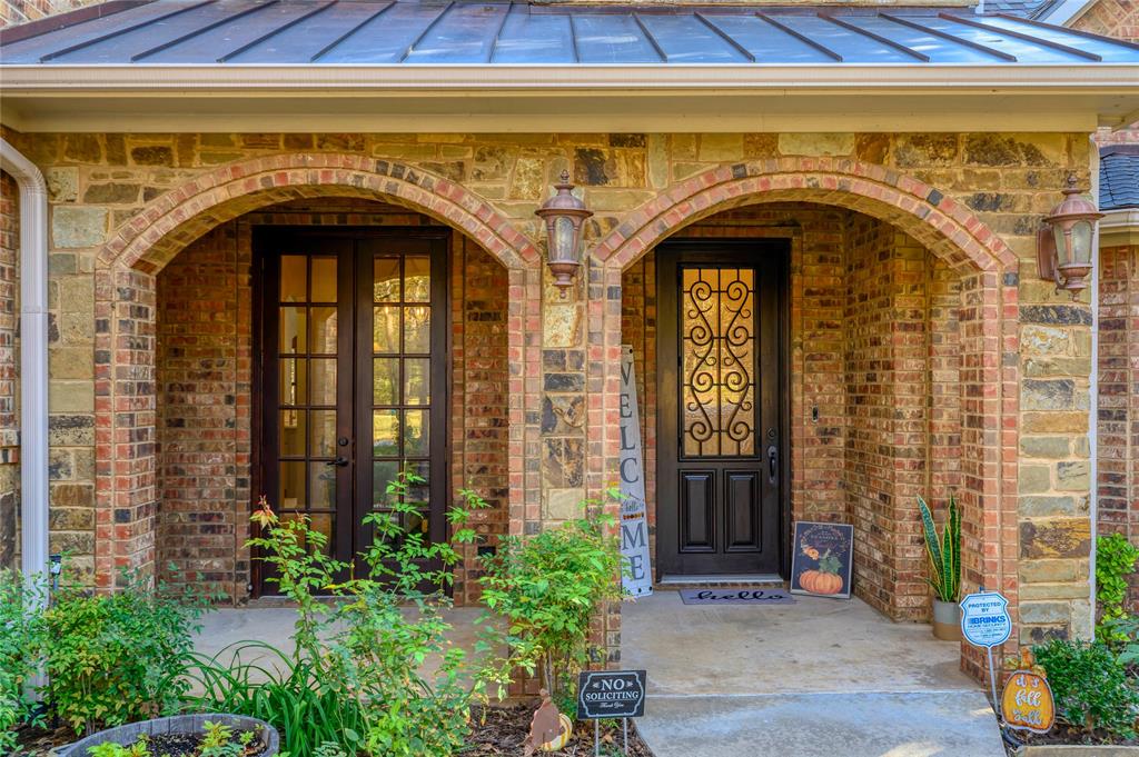 588 Lakepoint Loop Pottsboro, TX 75076 - Photo 6 of 39 a front view of a house with a door and a window