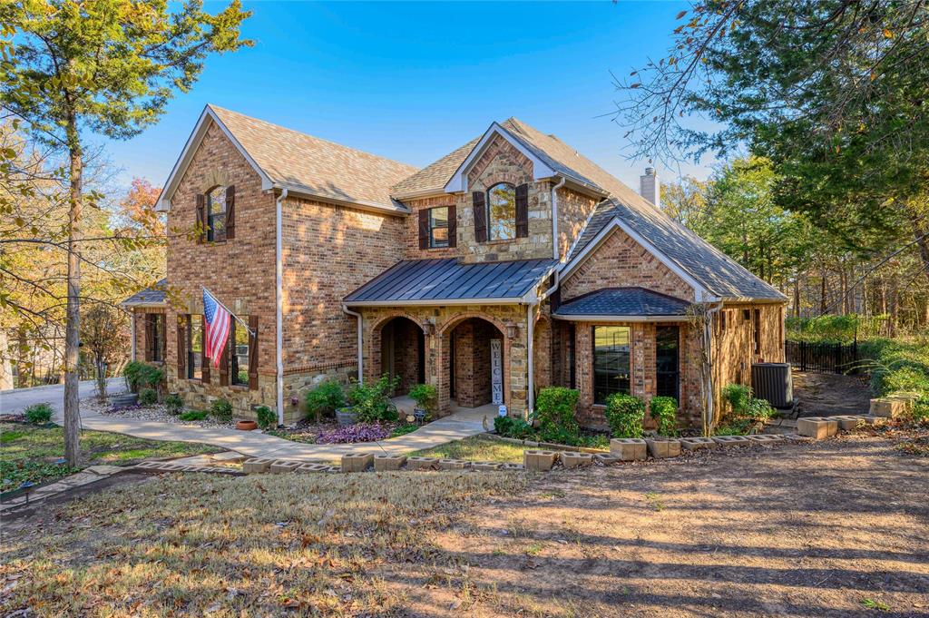 588 Lakepoint Loop Pottsboro, TX 75076 - Photo 8 of 39 a front view of a house with garden