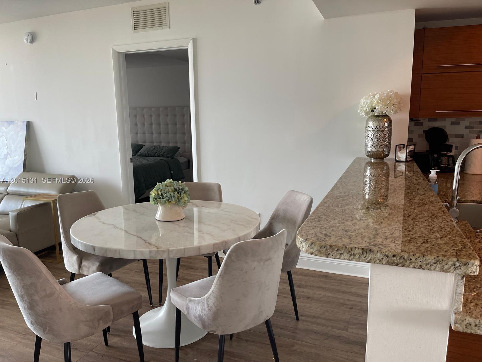 2681 North Flamingo Road, Unit 2004S Sunrise, FL 33323 - Photo 9 of 26 a view of a dining room with furniture