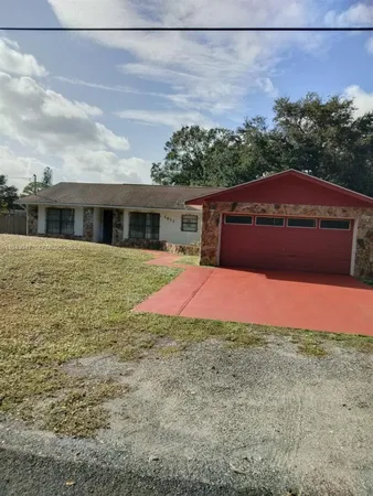 a view of front of house with a yard