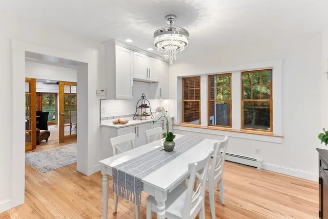 a kitchen with a table chairs and a dining table view