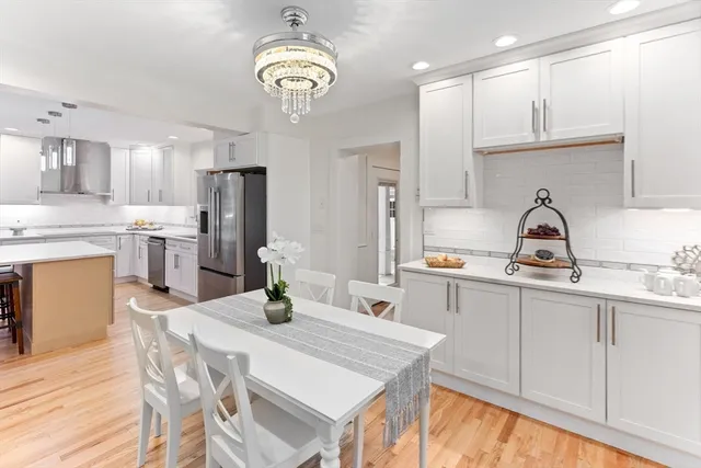 a kitchen with refrigerator a sink and cabinets