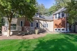 front view of a house with a yard and a trees