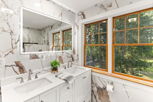 a bathroom with a sink and mirror