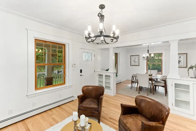 a view of a livingroom with furniture and a window