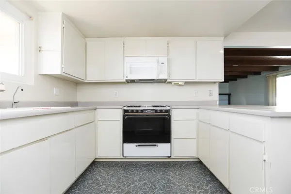a view of cabinets and wooden door
