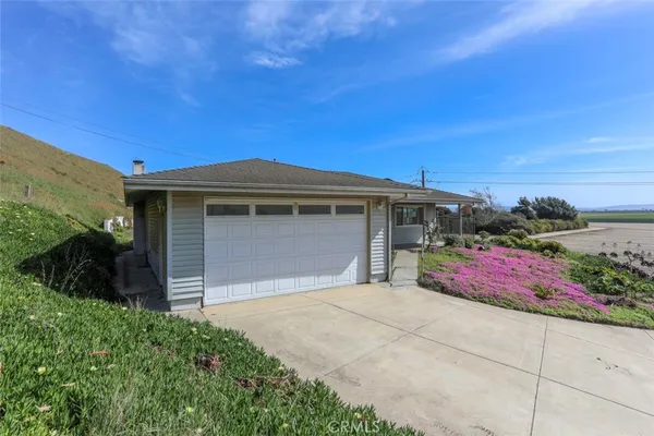 a front view of a house with a garage