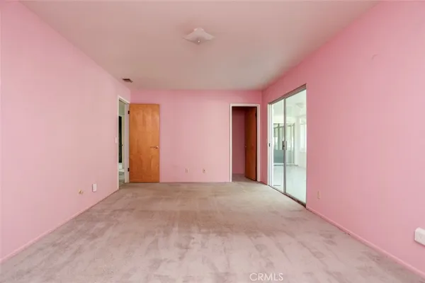 an empty room with closet area