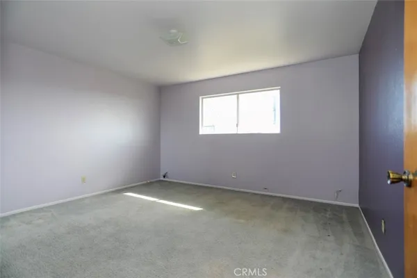 an empty room with a bathroom