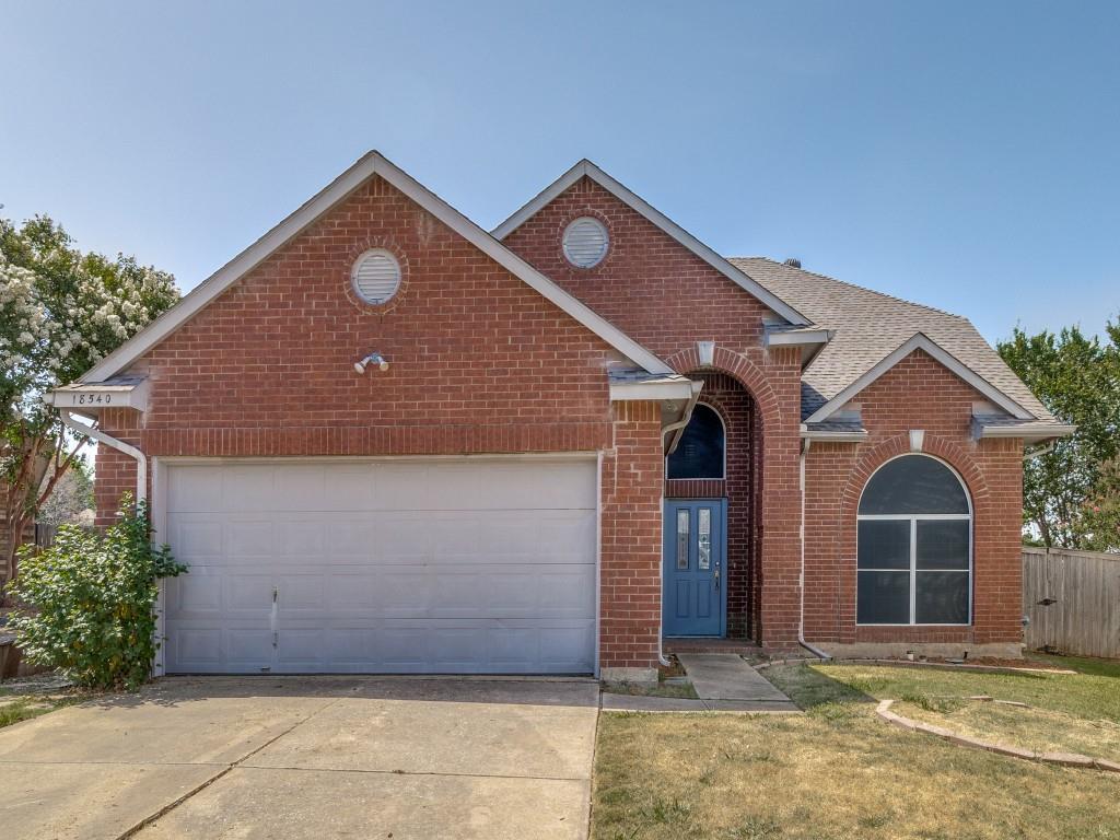18540 Shadow Ridge Drive Dallas, TX 75287 - Photo 1 of 1 a front view of a house with a yard