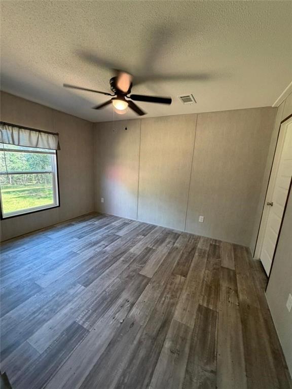 2606 Whipporwill Road Royston, GA 30662 - Photo 9 of 30 wooden floor in an empty room with a window