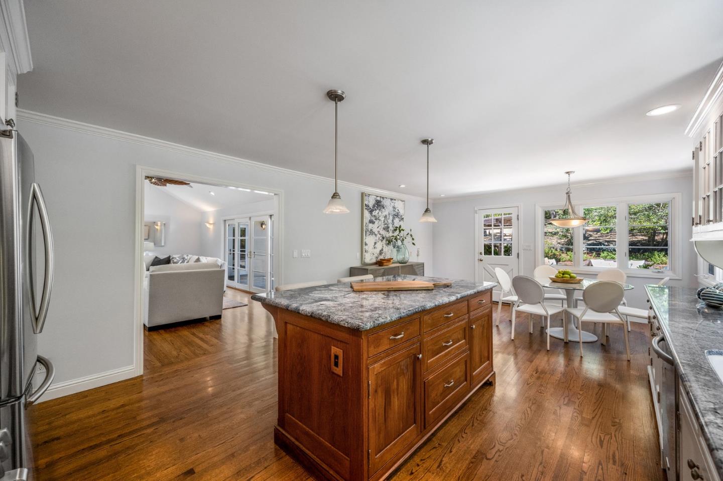 1585 Canada Lane Woodside, CA 94062 - Photo 12 of 46 a kitchen with stainless steel appliances granite countertop a stove and a refrigerator