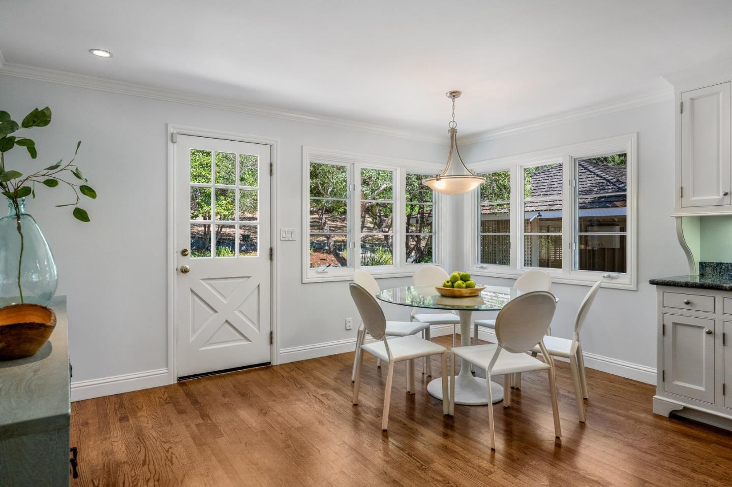 1585 Canada Lane Woodside, CA 94062 - Photo 14 of 46 a dining room with furniture a chandelier and wooden floor