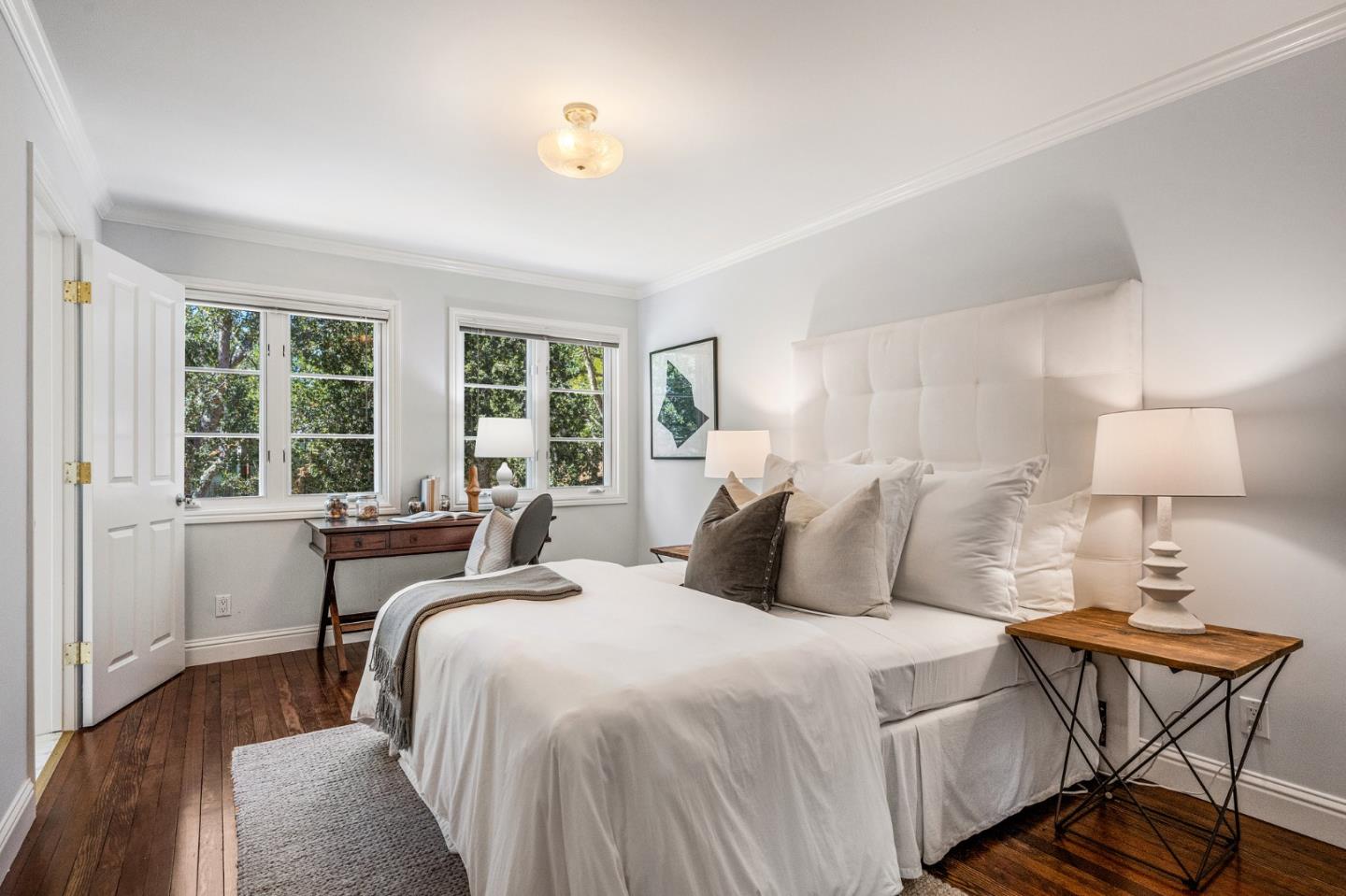 1585 Canada Lane Woodside, CA 94062 - Photo 22 of 46 a bedroom with a bed and a table in it