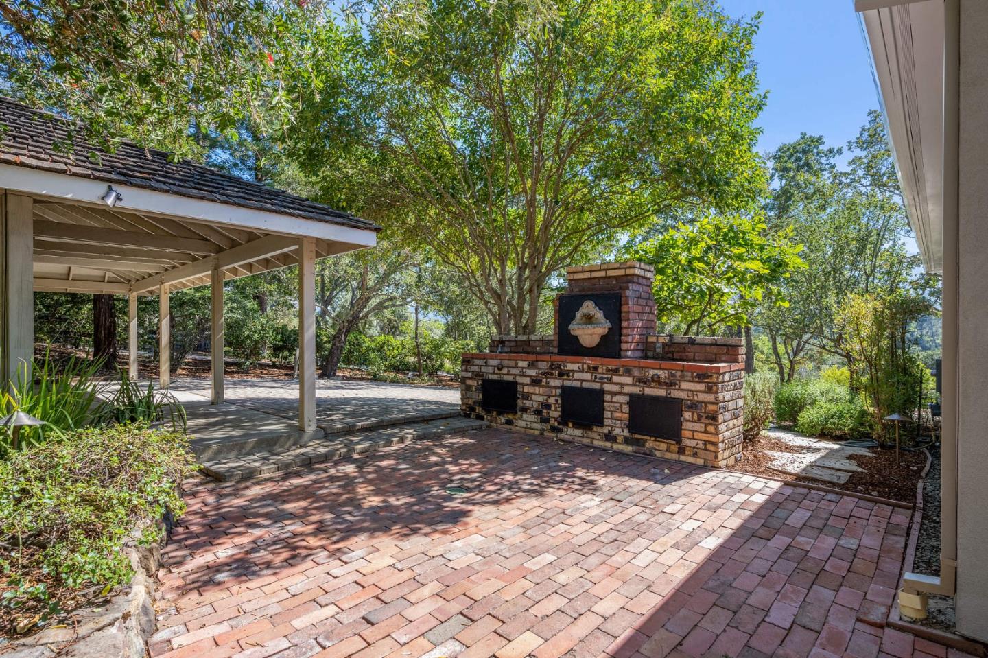 1585 Canada Lane Woodside, CA 94062 - Photo 29 of 46 a view of a sitting area with trees in the background