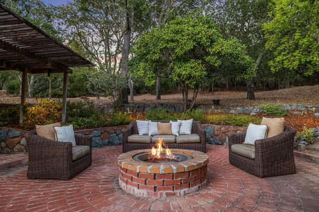 a patio with patio a couch and chairs