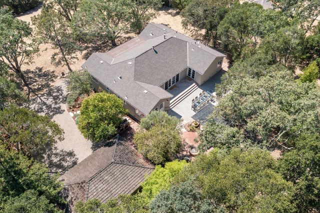 an aerial view of a house with yard and outdoor space
