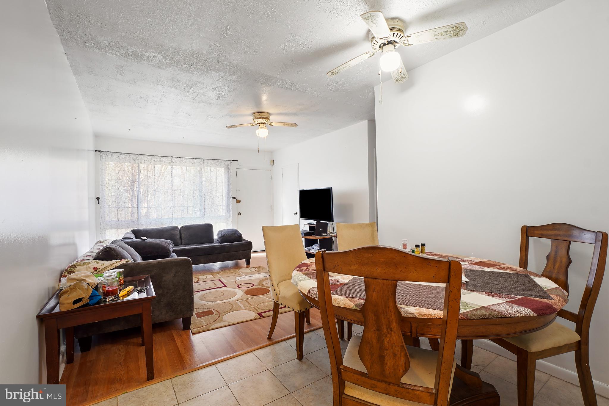 7523 Greenleaf Road Landover, MD 20785 - Photo 11 of 30 a view of a livingroom with furniture and a flat screen tv