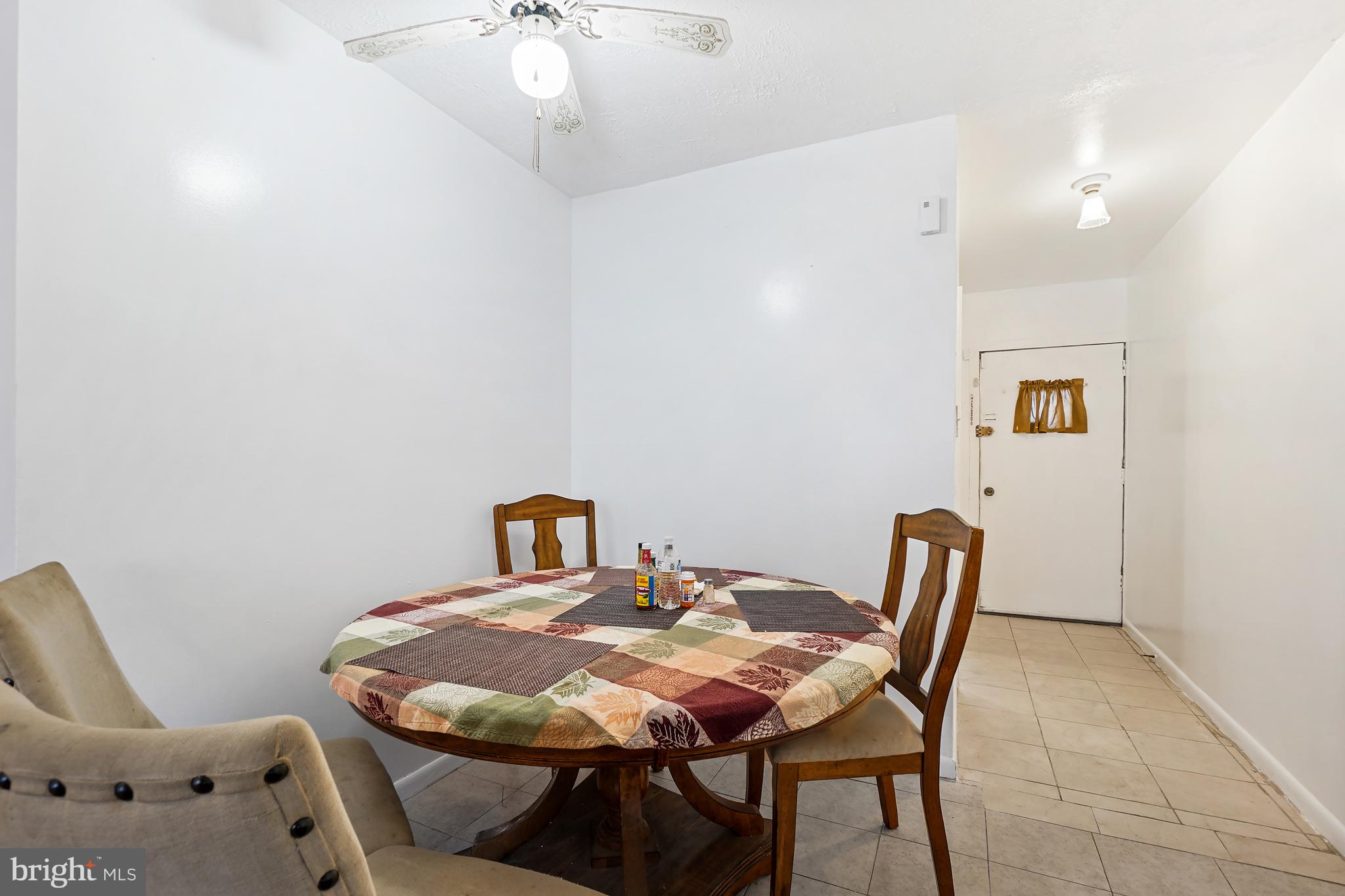 7523 Greenleaf Road Landover, MD 20785 - Photo 12 of 30 a view of a dining room with furniture and wooden floor