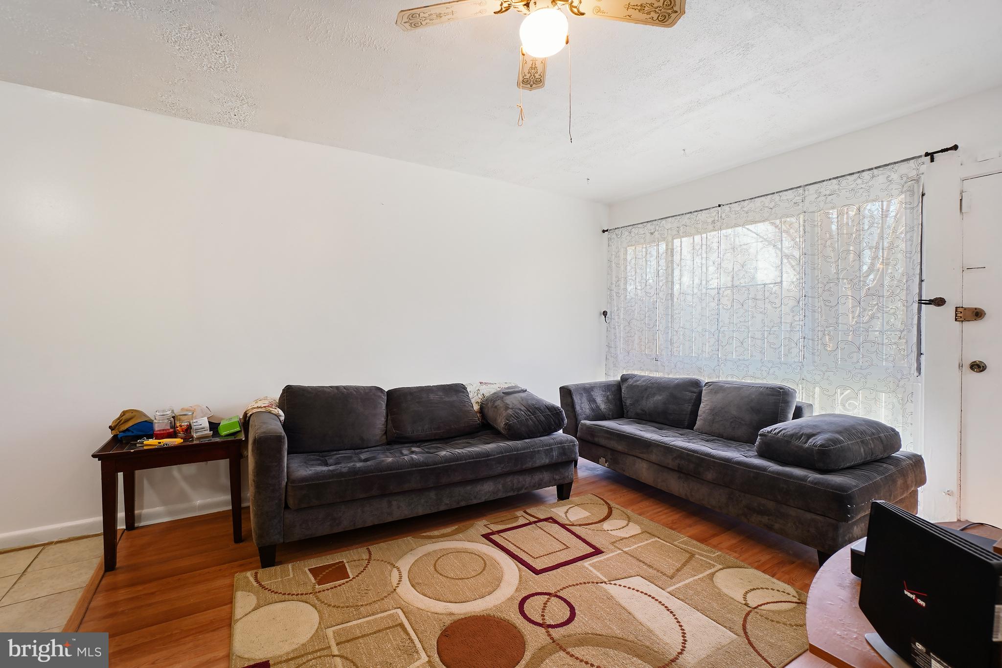 7523 Greenleaf Road Landover, MD 20785 - Photo 13 of 30 a living room with furniture and a wooden floor