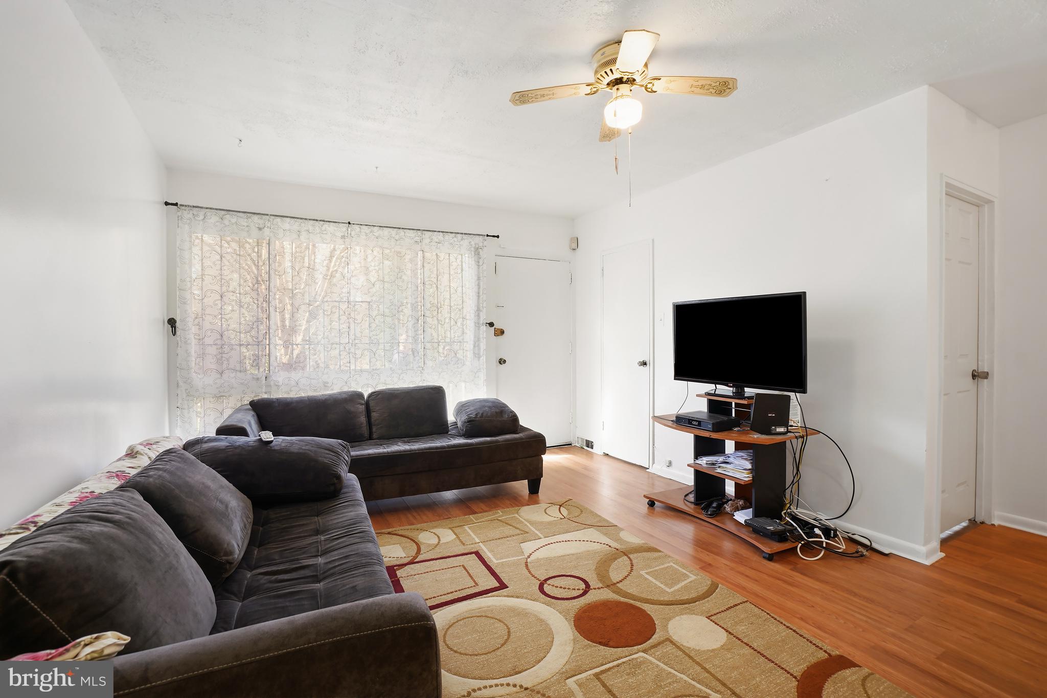 7523 Greenleaf Road Landover, MD 20785 - Photo 14 of 30 a living room with furniture and a flat screen tv