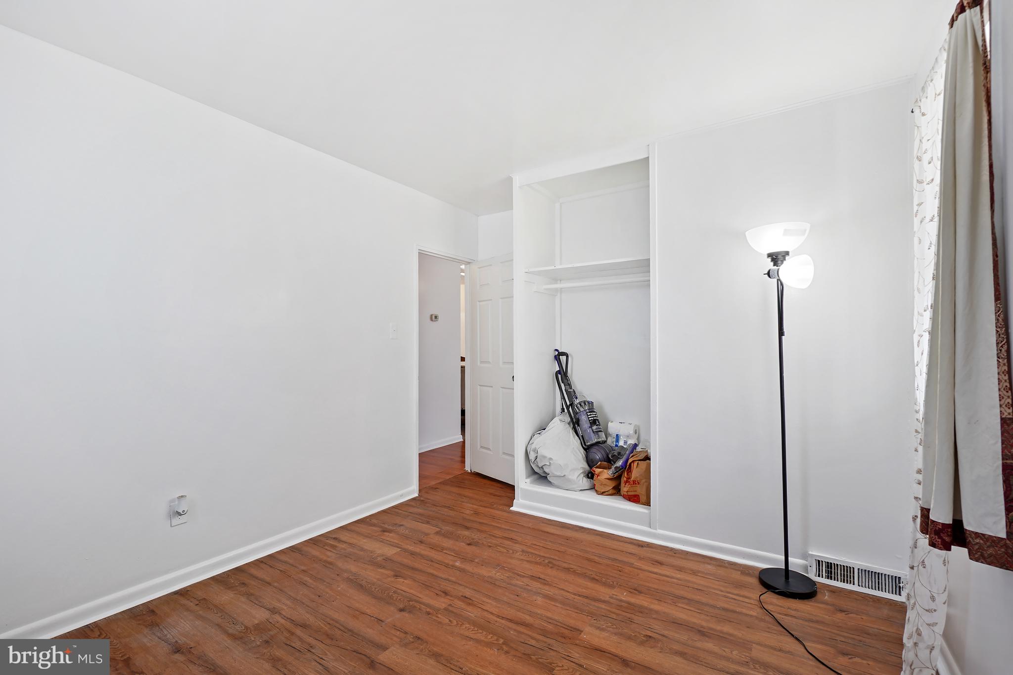 7523 Greenleaf Road Landover, MD 20785 - Photo 19 of 30 a view of a room with wooden floor and a window