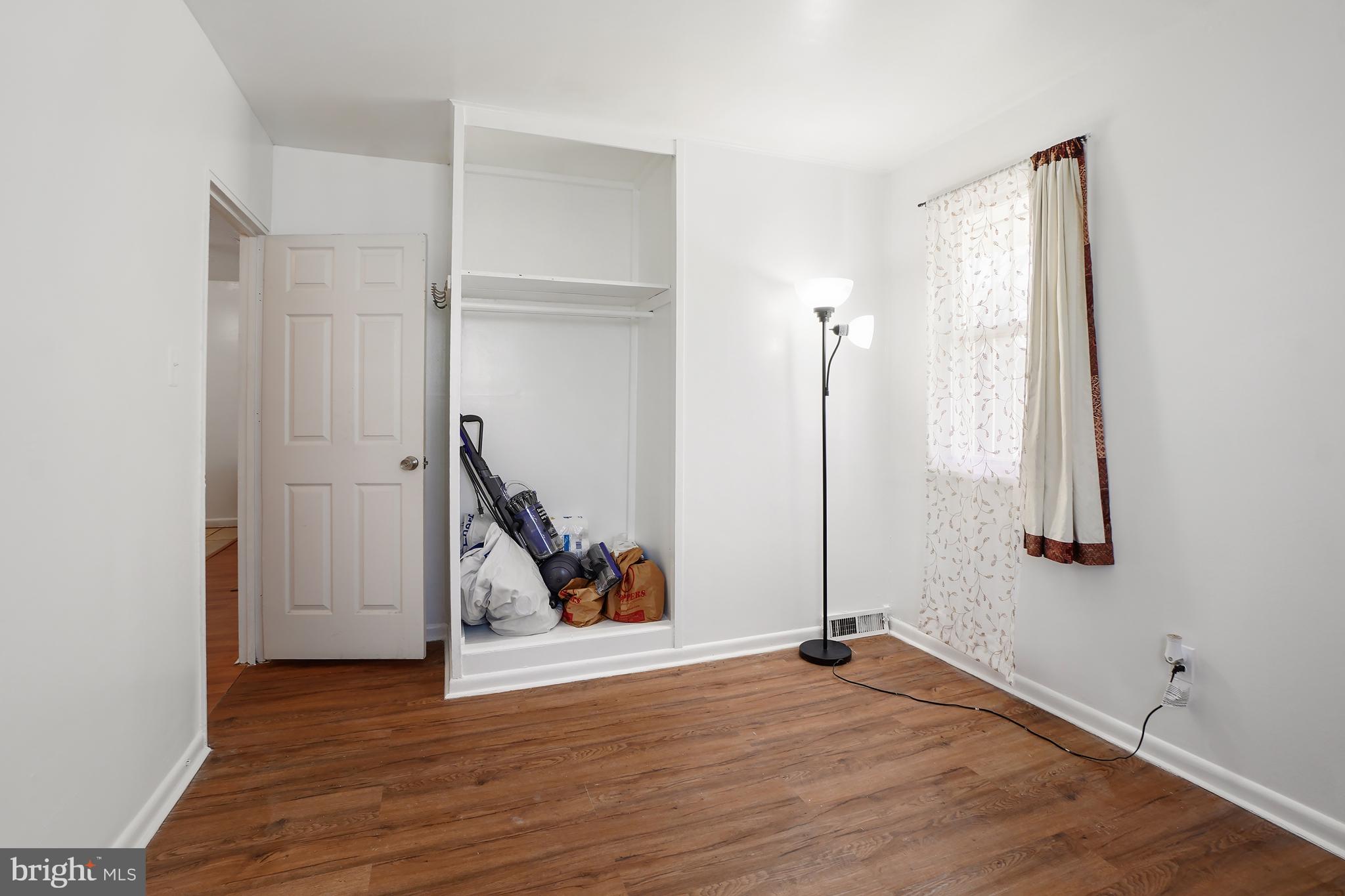 7523 Greenleaf Road Landover, MD 20785 - Photo 20 of 30 a view of a room with gym equipment and wooden floor