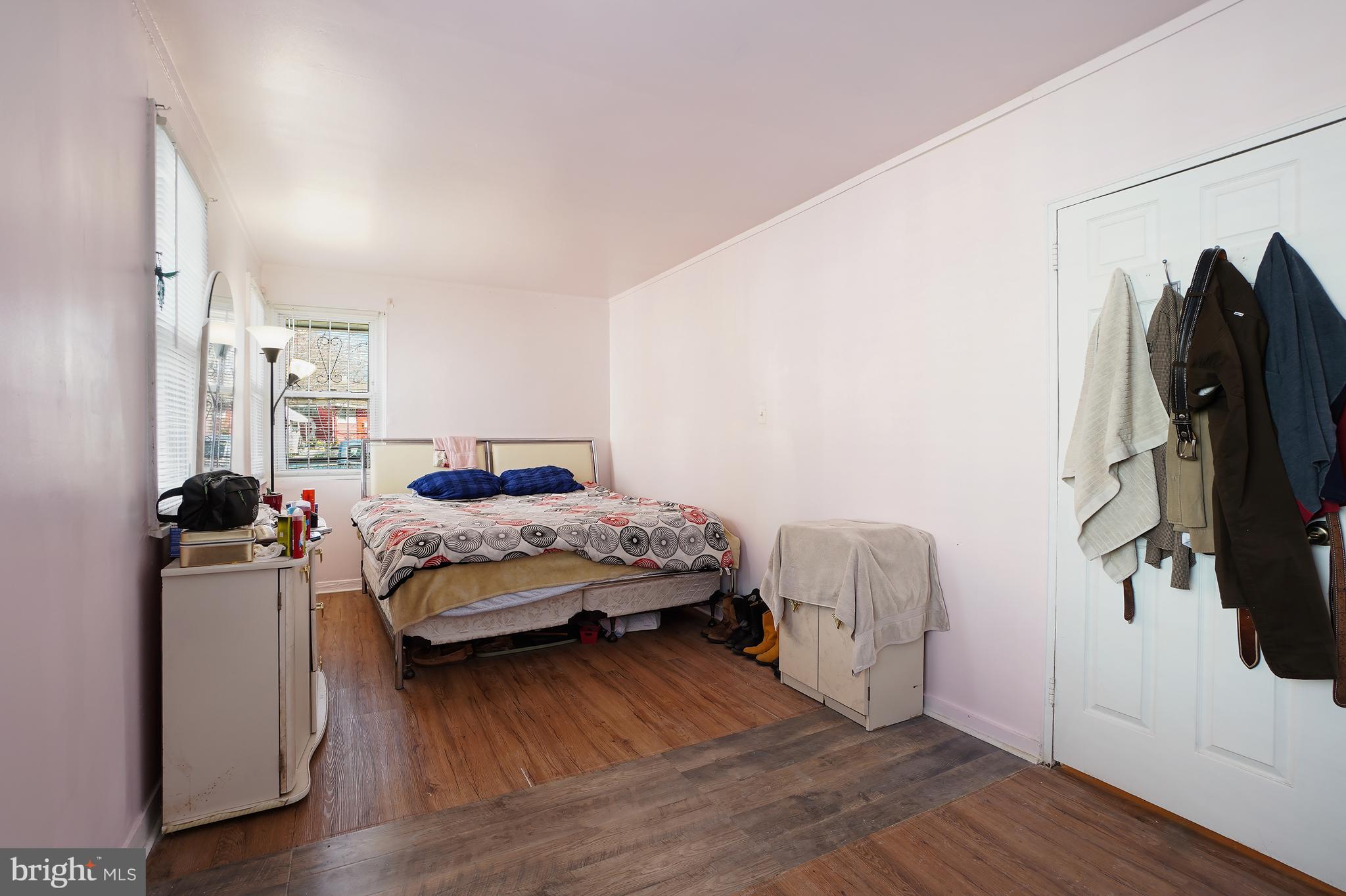 7523 Greenleaf Road Landover, MD 20785 - Photo 22 of 30 a bedroom with a bed and a mirror
