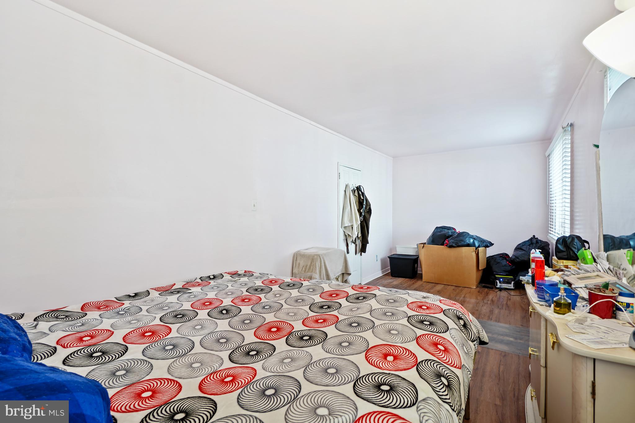7523 Greenleaf Road Landover, MD 20785 - Photo 23 of 30 a bedroom with a bed and a dresser