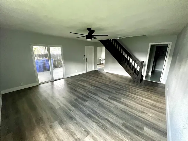 a view of an entryway with wooden floor